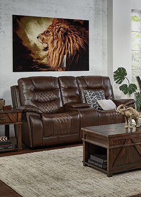brown loveseat with lion wall art above it